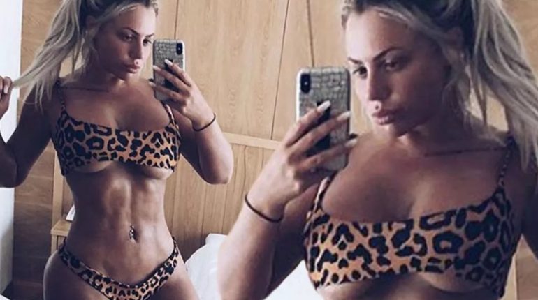 Busting out! Holly Hagan struggles to contain her breasts in too-small bikini as she shows off ridiculously ripped stomach